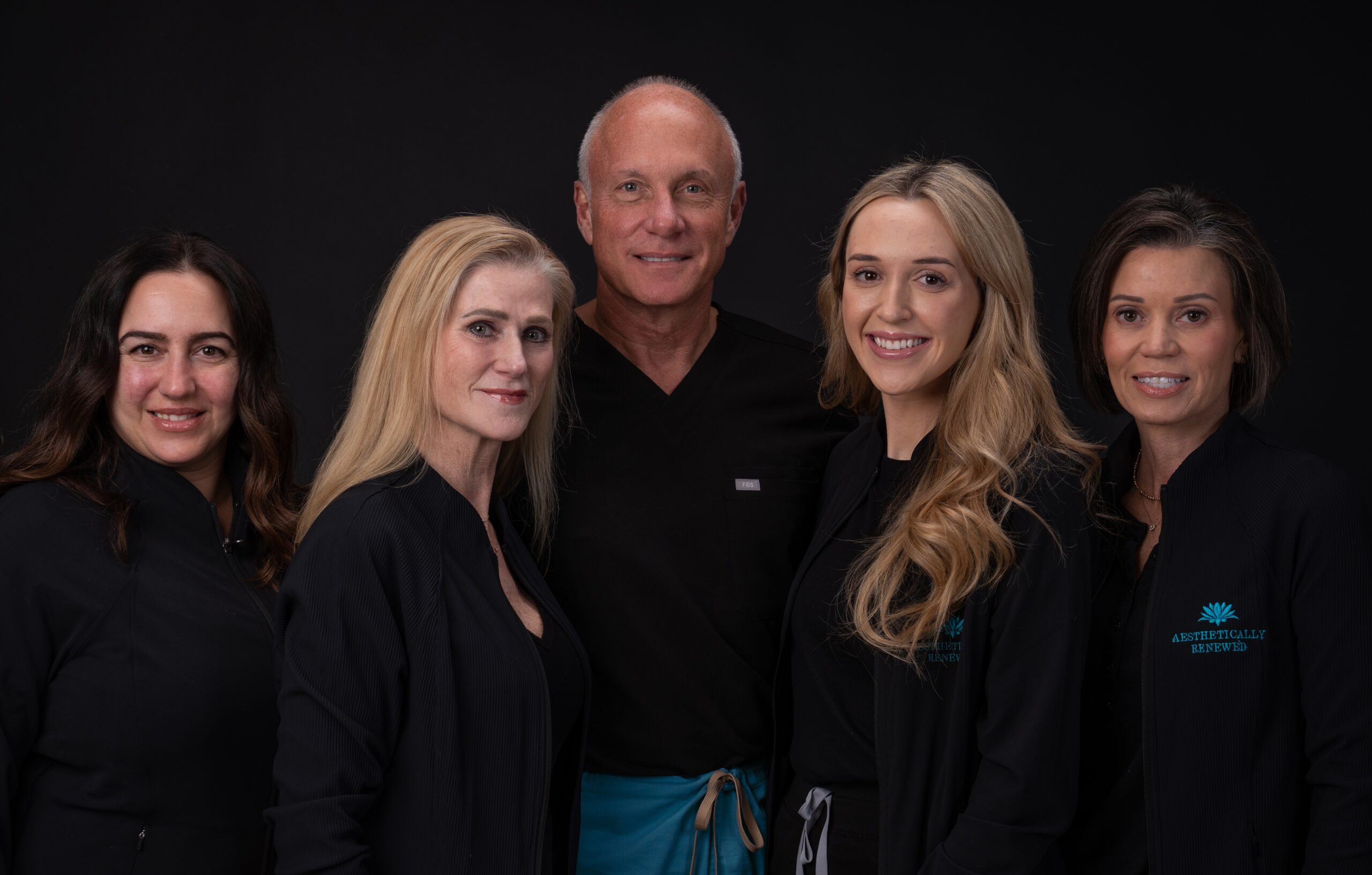 a group of people posing for the camera